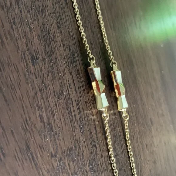 KATE Spade enamel/gold bow gold tone chain necklace